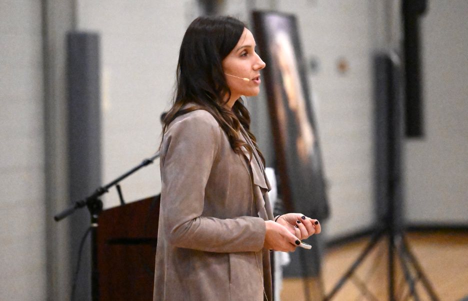 Coach Lindsay Fullerman giving a talk.